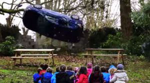 The car flips as the children are helpless.